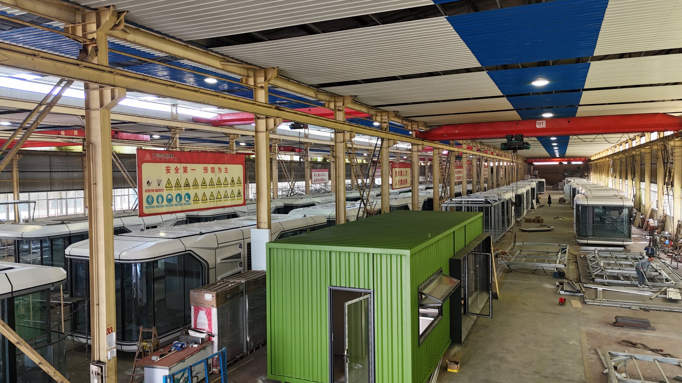 Factory workshop with capsule cabin bodies and modular components in production